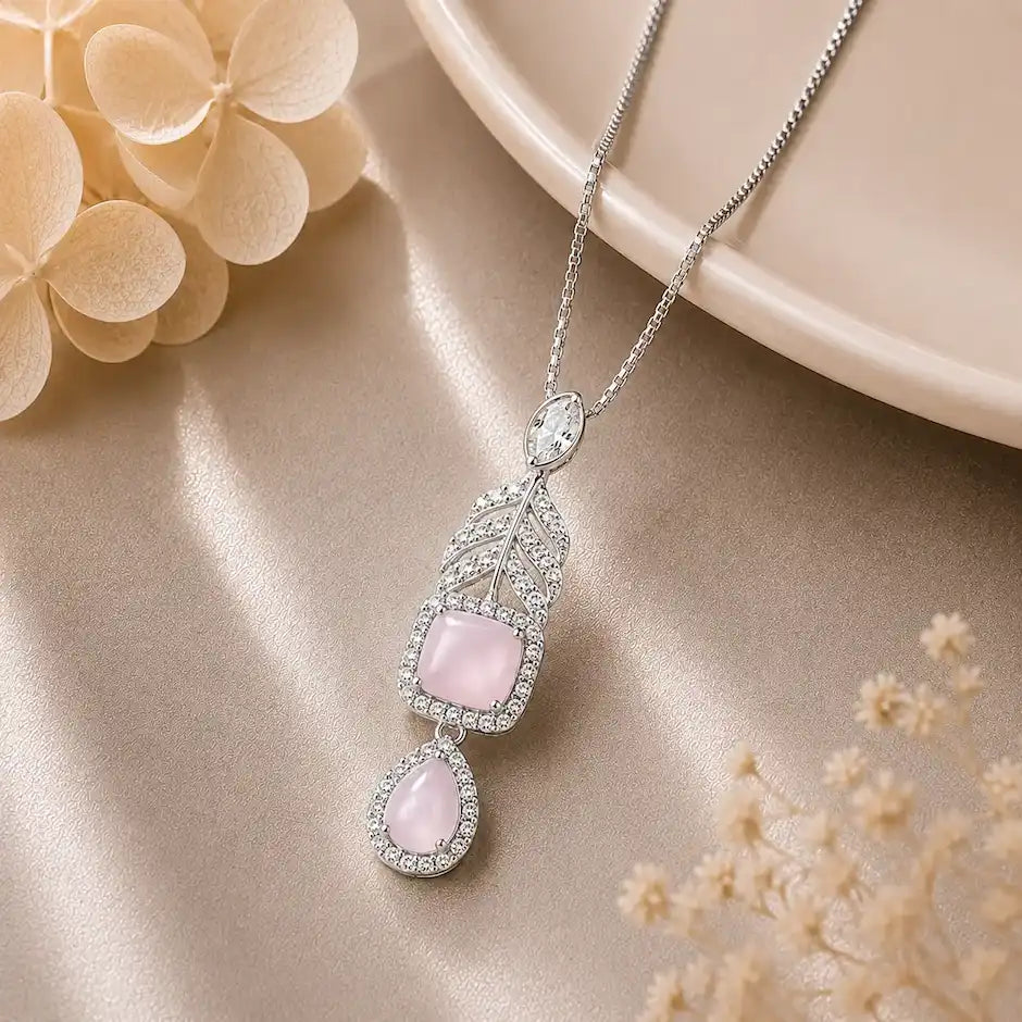 Silver Celestial Drop Pendant Necklace featuring a square and teardrop double-halo pendant set with deep blue stones and sparkling clear zircon crystal accents.